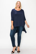 Load image into Gallery viewer, Solid top featuring a round neck, three quarter sleeves, and a high-low hem
