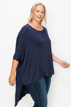 Load image into Gallery viewer, Solid top featuring a round neck, three quarter sleeves, and a high-low hem
