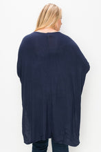 Load image into Gallery viewer, Solid top featuring a round neck, three quarter sleeves, and a high-low hem
