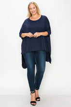 Load image into Gallery viewer, Solid top featuring a round neck, three quarter sleeves, and a high-low hem

